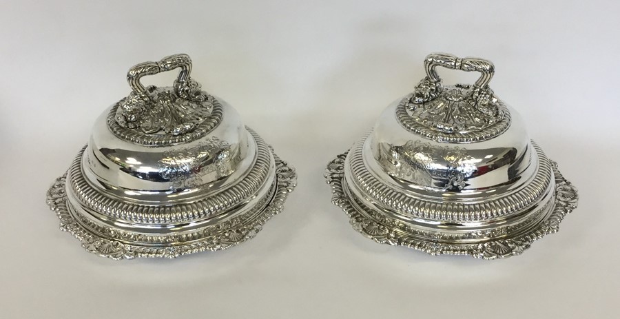 A pair of good quality domed entrée dishes, the ha