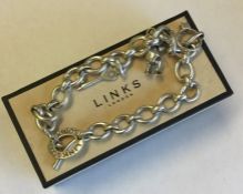 LINKS OF LONDON: A silver curb link bracelet. Appr