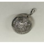 An Indian silver rattle of typical design. Approx.