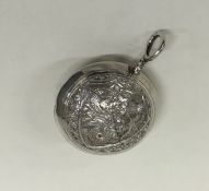 An Indian silver rattle of typical design. Approx.