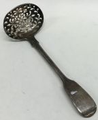 A fiddle pattern silver sifter spoon. London. By R