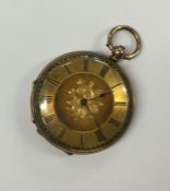 A 9 carat lady's fob watch with gilt dial. Approx.