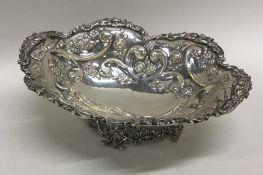 A Georgian style cast silver fruit basket profusel