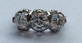 A large attractive diamond three stone ring in pie