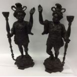 A pair of large heavy bronze Blackamoor figures wi