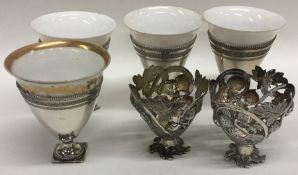 A set of four unusual Continental silver egg cups