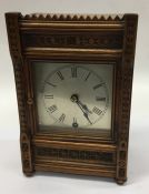 An Edwardian mahogany mantle clock with silvered d