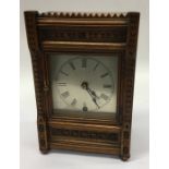 An Edwardian mahogany mantle clock with silvered d