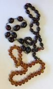 A graduated string of beads together with two othe