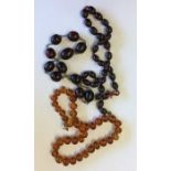 A graduated string of beads together with two othe