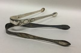 A pair of Georgian silver bright cut sugar tongs t