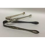 A pair of Georgian silver bright cut sugar tongs t