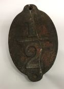 An Antique cast iron "1/2" mile wall plaque. Est.