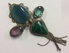 A group of four silver and stone set pendants. App