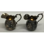 A pair of Continental miniature silver ewers with