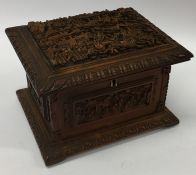 A heavy Chinese wooden casket with fitted interior