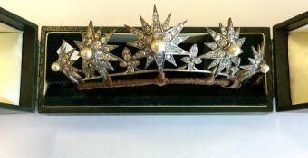 A good large silver tiara in the form of sunbursts