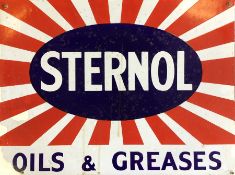 A rectangular "Sternol Oils & Greases" metal and e