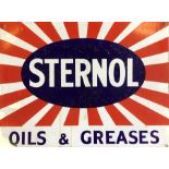 A rectangular "Sternol Oils & Greases" metal and e