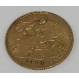 A 1910 half sovereign. Est. £70 - £80.