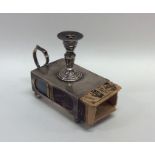 An unusual novelty silver match holder in the form