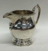 A good Edwardian cream jug on circular base. Appro