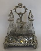 A Victorian seven bottle silver cruet with pierced