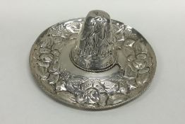 A Mexican silver miniature sombrero embossed with