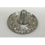 A Mexican silver miniature sombrero embossed with