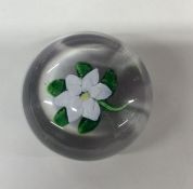 A French 19th Century glass paperweight with flowe