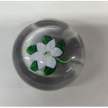 A French 19th Century glass paperweight with flowe