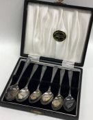 A boxed set of six silver coffee spoons. Sheffield