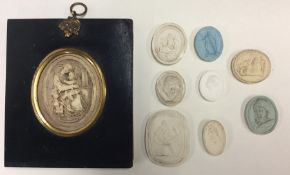 A collection of old seals together with a small mi