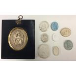 A collection of old seals together with a small mi