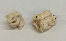 Two small carved ivory netsukes in the form of ani