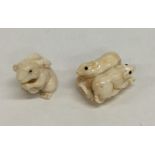 Two small carved ivory netsukes in the form of ani