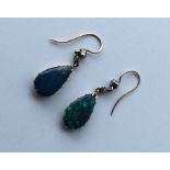 A pair of rare black opal teardrop earrings with r