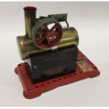 A Mamod steam engine on red base with burner. Est.