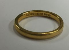 A 22 carat gold plain wedding band. Approx. 3 gram