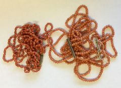An unusual triple string of coral beads etc. Appro