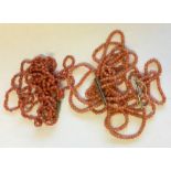 An unusual triple string of coral beads etc. Appro