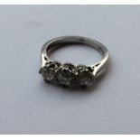 An Antique diamond three stone ring in traditional