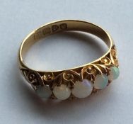 An 18 carat opal five stone half hoop ring in carv