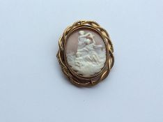 An oval cameo of children in gilt frame. Approx. 3