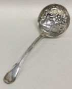 A large silver fiddle pattern sifter spoon with pi