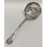 A large silver fiddle pattern sifter spoon with pi