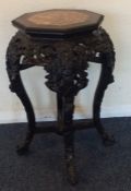 A good quality carved Chinese planter with marble