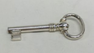 An unusual silver model of a key with spring mecha