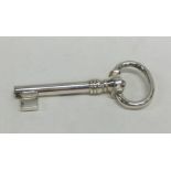 An unusual silver model of a key with spring mecha