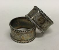 A pair of Victorian style silver napkin rings engr
